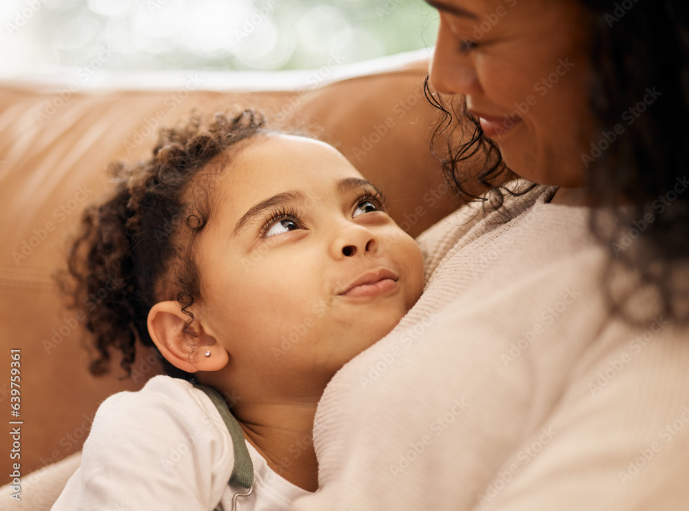 Love, hug and mother with girl child on a sofa with trust, support and bond at home together. Family