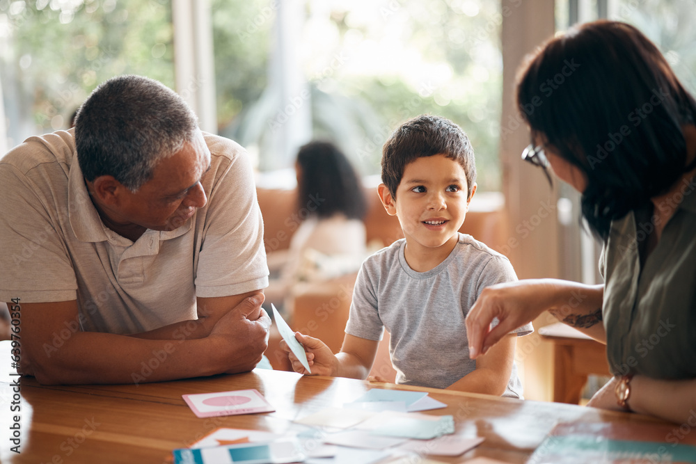 Home school, learning and parents support child with lesson and flash cards for education. Studying,