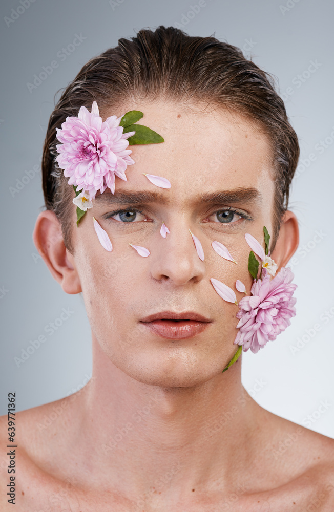 Head, cosmetics and flowers with portrait of man in studio for beauty, natural skincare and creative