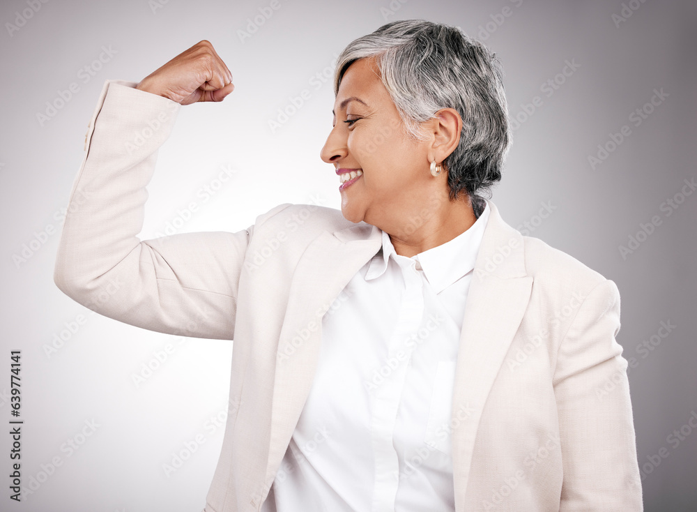 Strong, smile and mature businesswoman in a studio with strength, feminism or confidence gesture. Ha