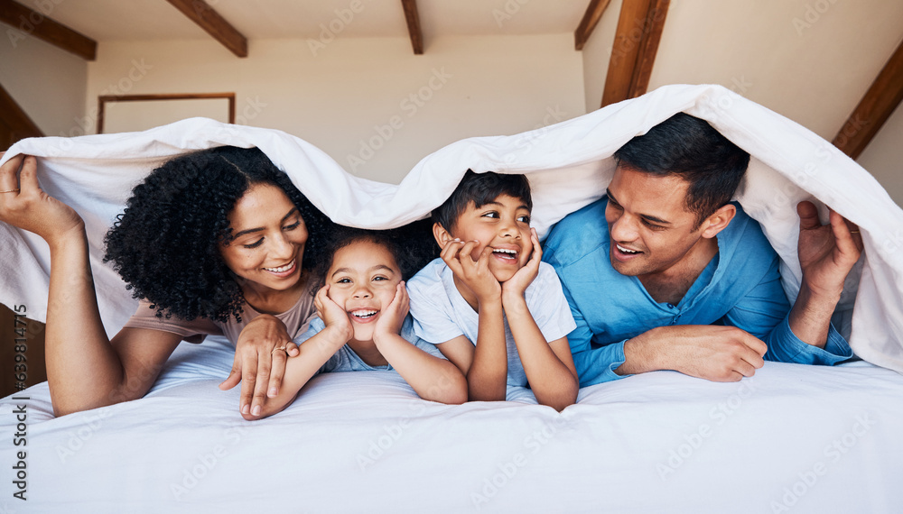 Smile, talking and family on a bed with a blanket for relaxing, bonding or resting together at home.