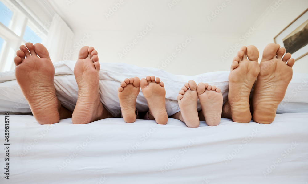 Family, feet and sleeping in bed in home, relax in peace and rest in morning blanket together. Baref