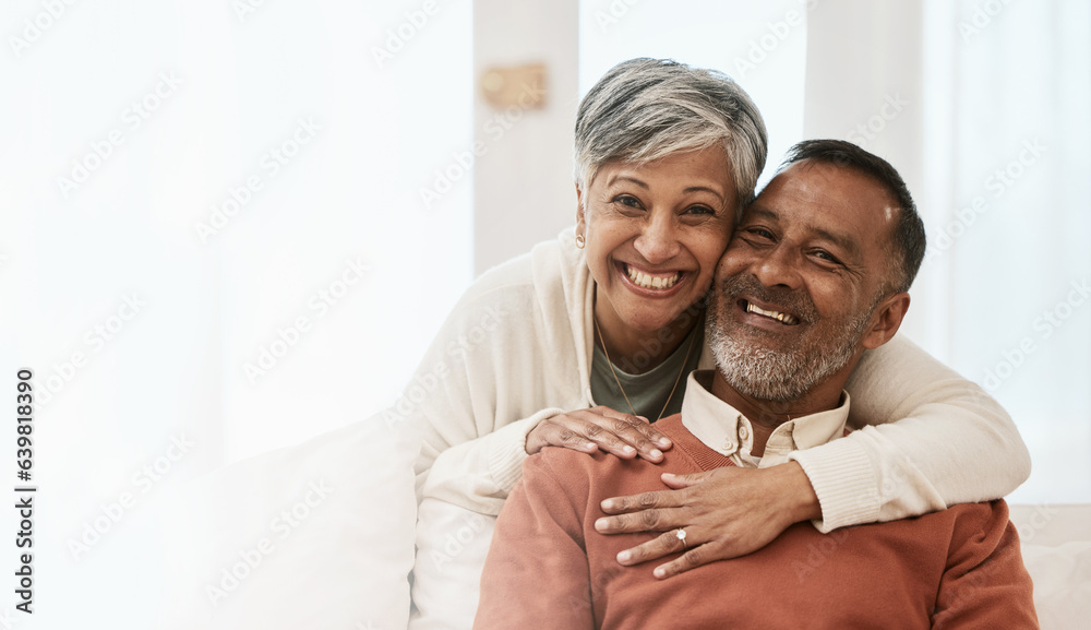 Portrait, smile and senior couple in home living room, bonding together and hug on mockup space. Hap