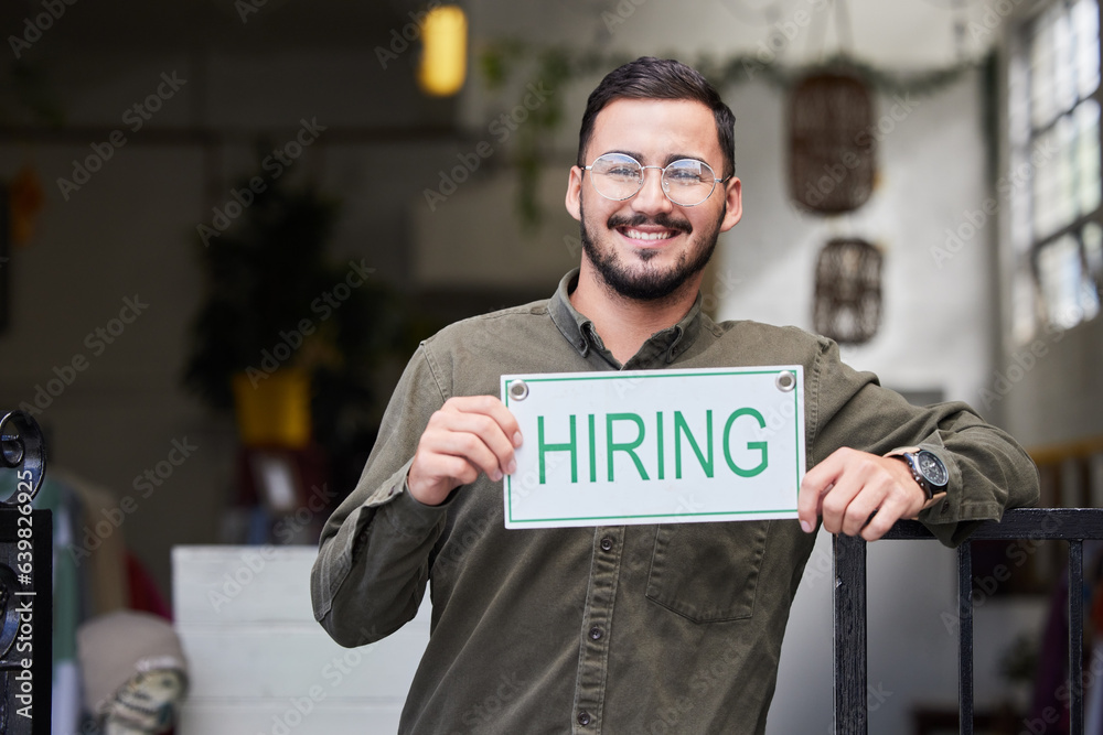 Portrait, man and we are hiring sign with recruiting, happy and smile from business owner. Male pers