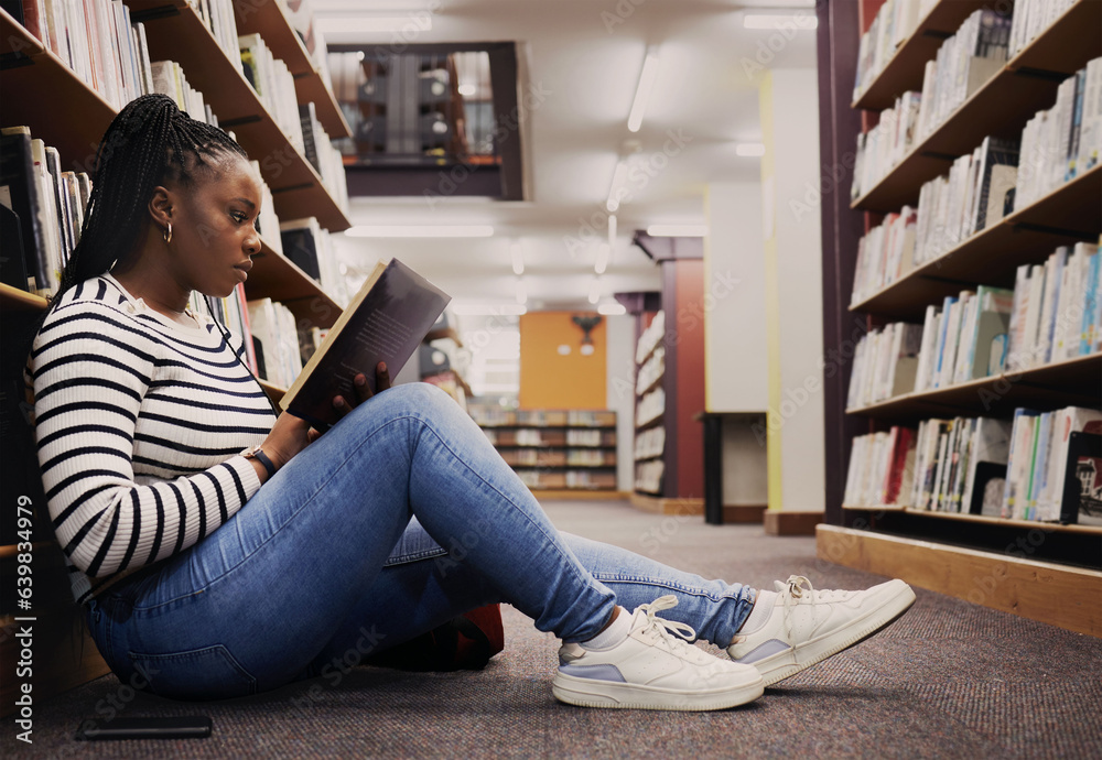 Research, book and a black woman in a library for reading, college knowledge or studying on the floo