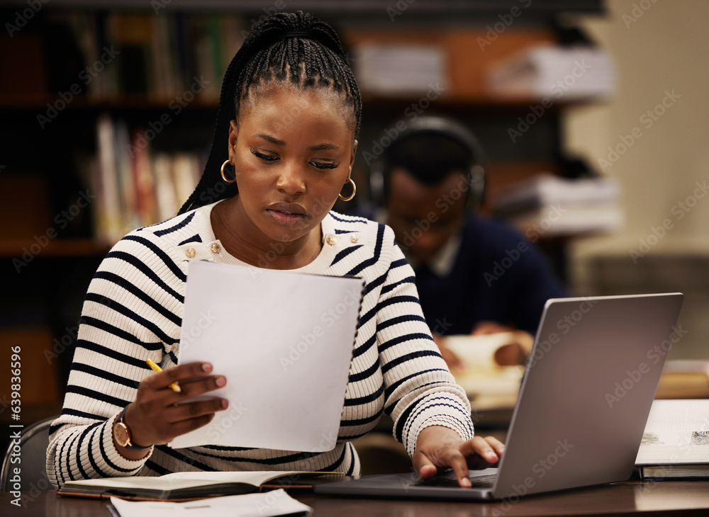 Student, woman and documents on laptop in library for study, research and planning in university. Yo