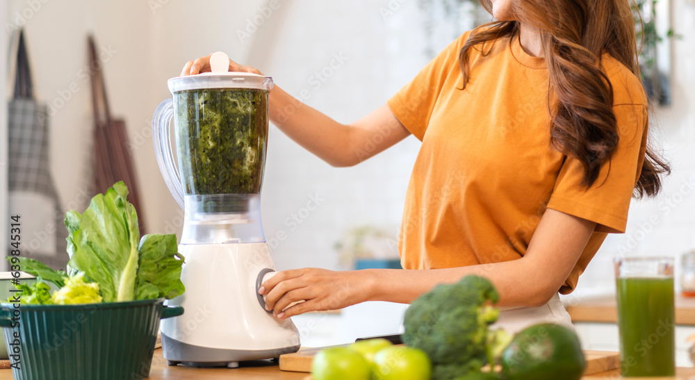 Portrait of beauty healthy asian woman making green vegetables detox cleanse and green fruit smoothi