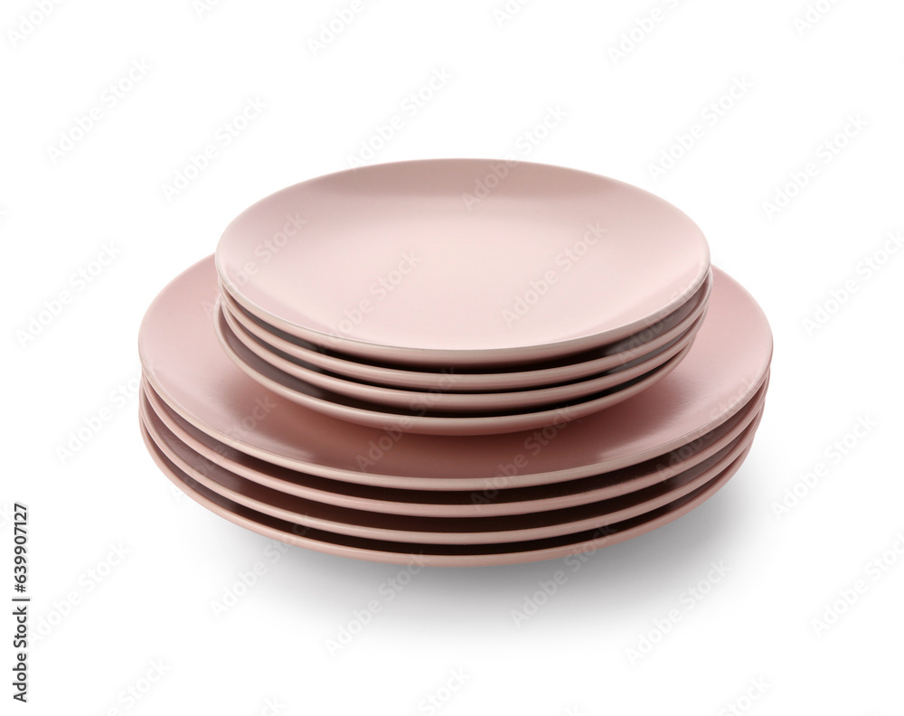 Stack of pink plates on white background