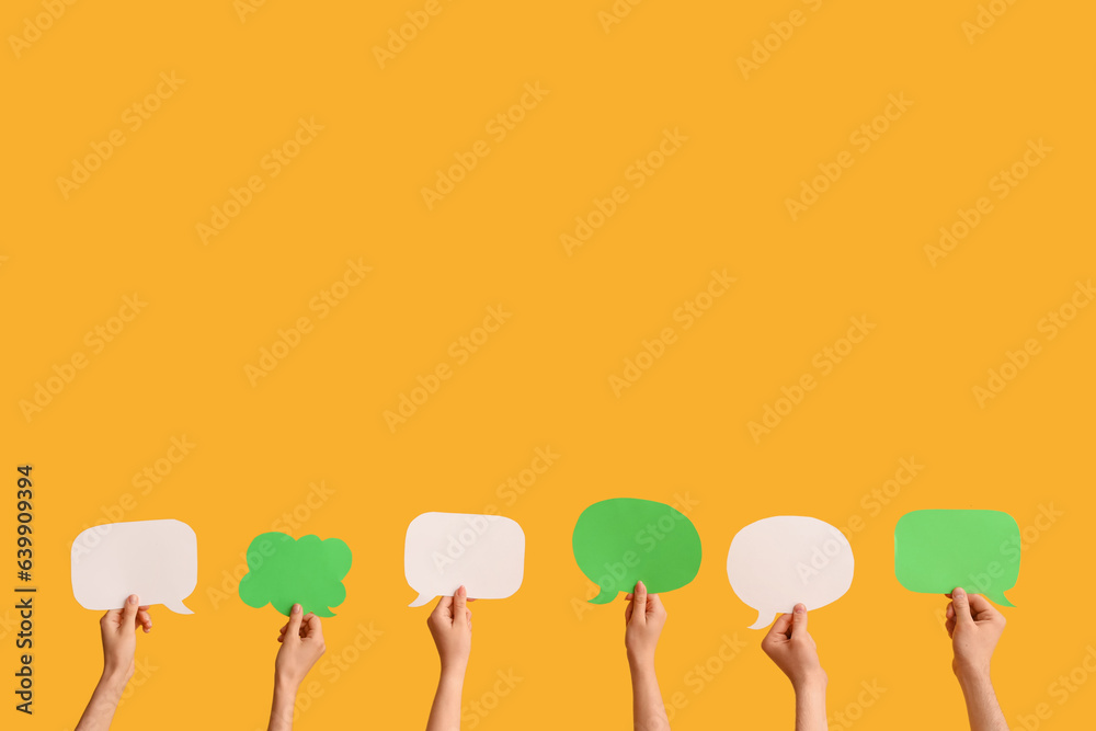 Different hands with speech bubbles on yellow background