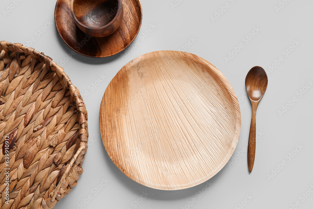 Different wooden tableware on white background