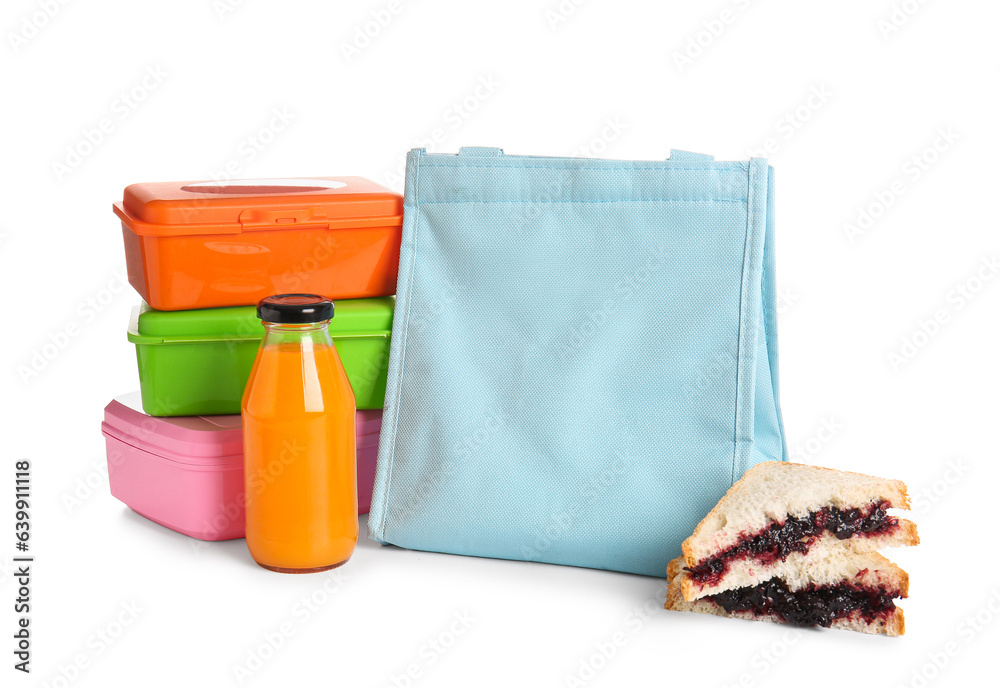 Bag, lunchboxes, berry pie and bottle of juice isolated on white background