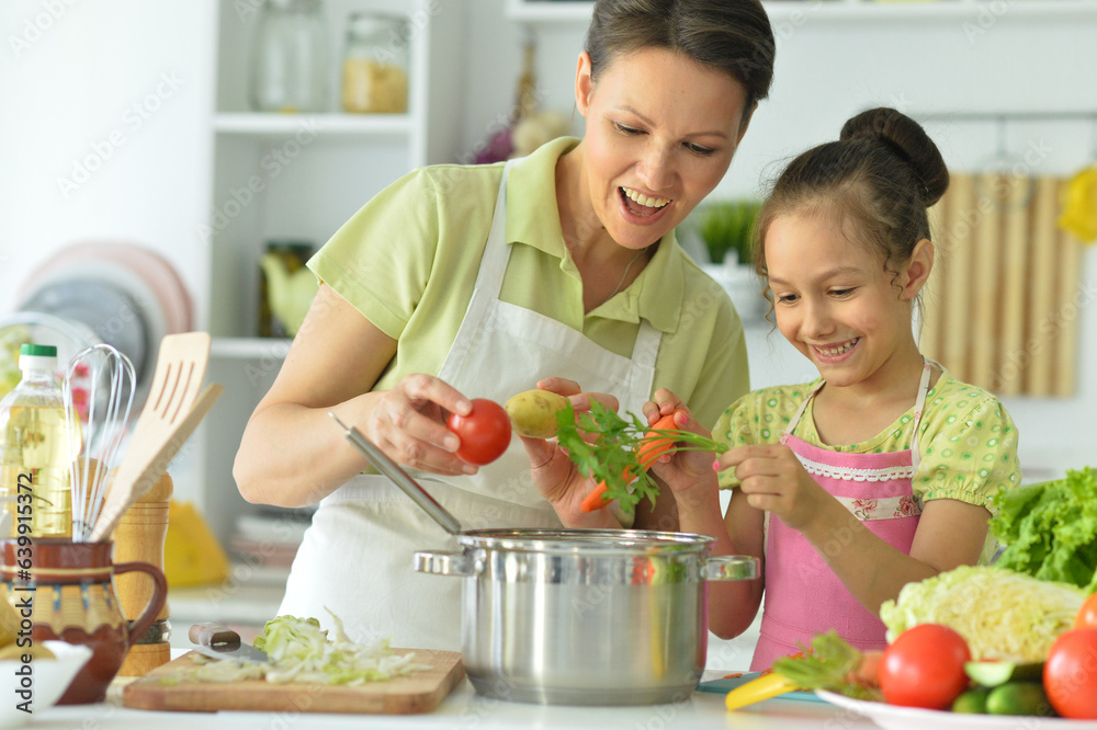 mom and daughter on kitchen