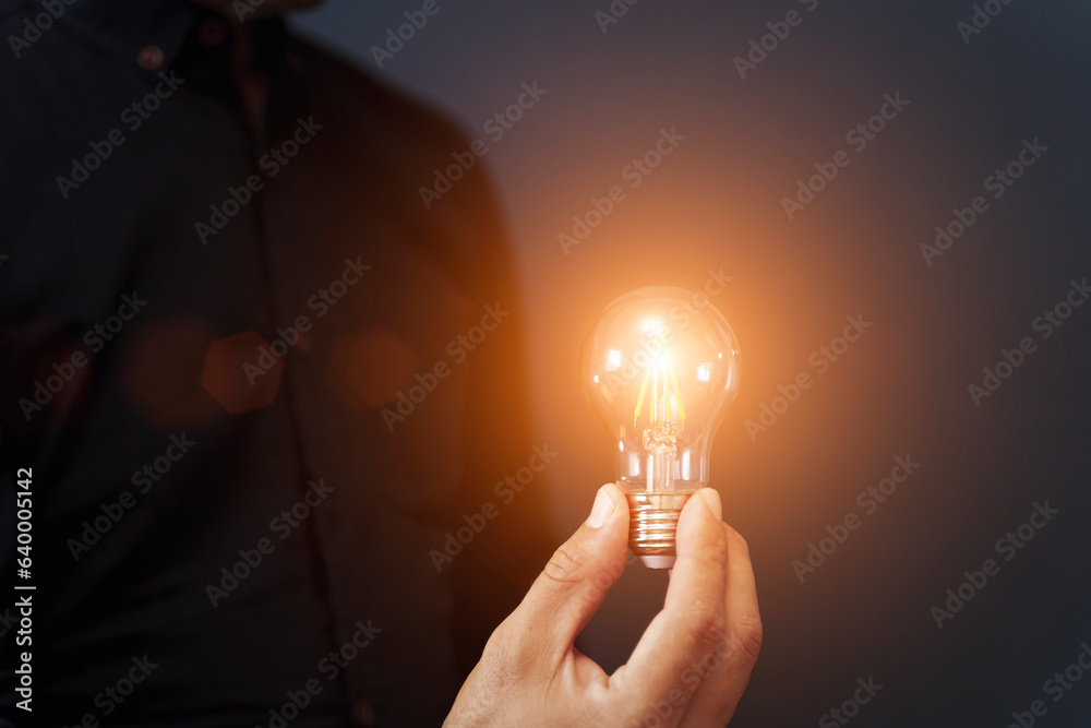 Knowledge idea bulb concept. Electric light bulb in hand business manager. Innovation, brain, creati