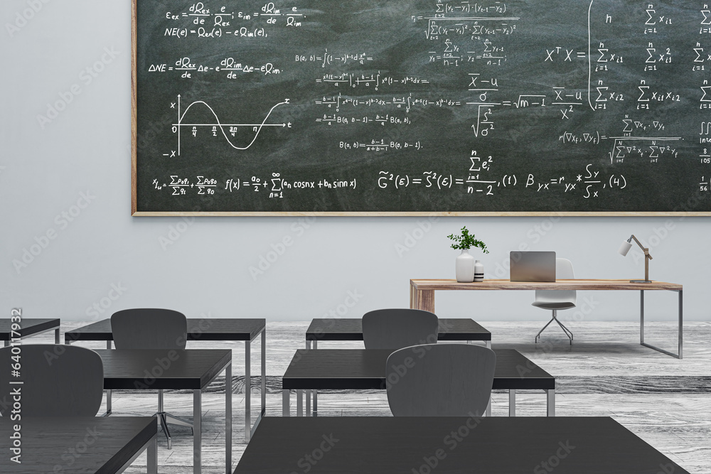 Modern gray classroom interior with formulas on chalkboard, furniture and wooden flooring. Back to s