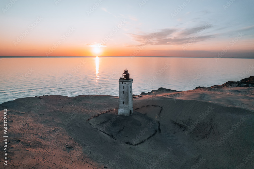 Aerial Drone Photo at Rubjerg Knude Lighthouse during sunset, Denmark Coastline