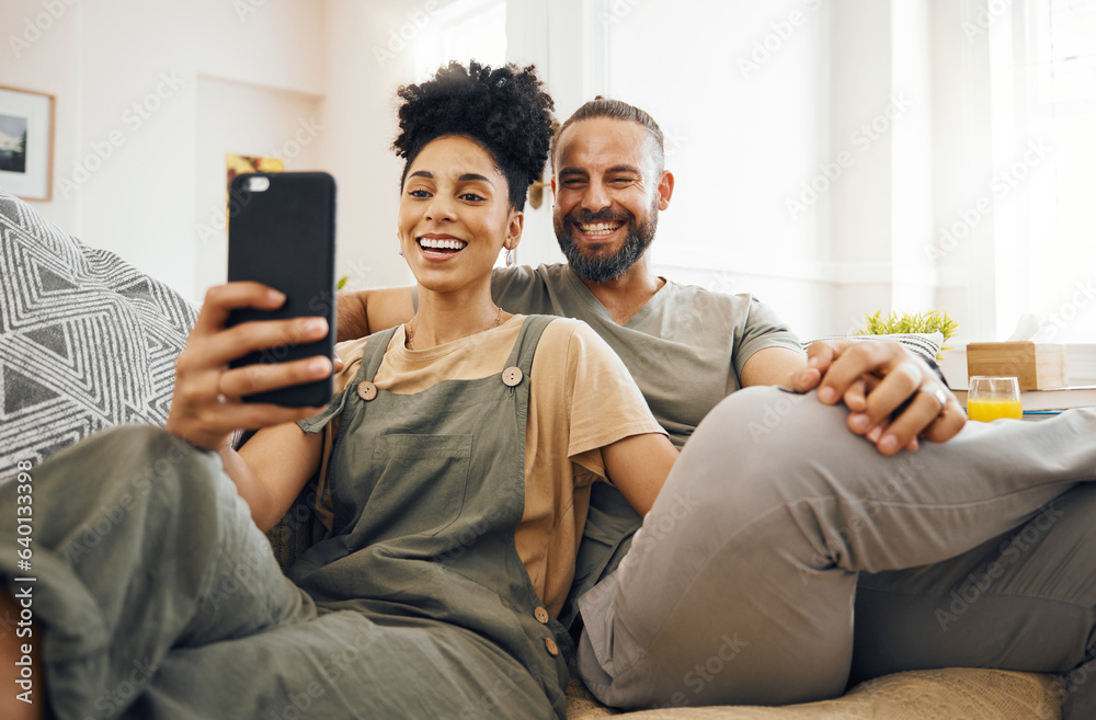 Interracial couple, selfie and smile on sofa, holding hands and together for memory, web blog or pos