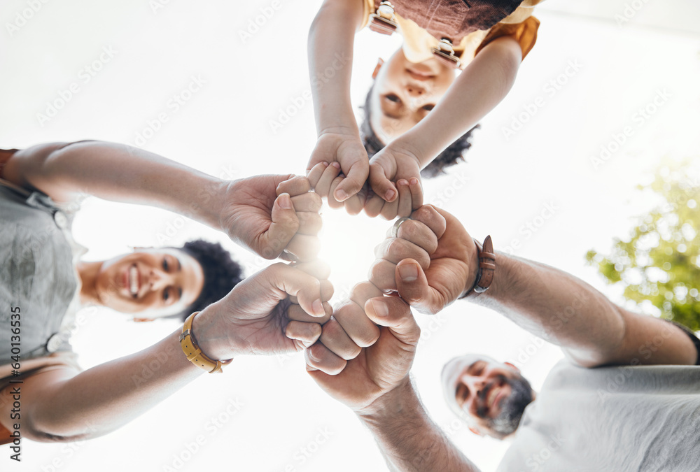 Family, fist bump and circle outdoor together in low angle, happy and bonding. Father, mother and ch