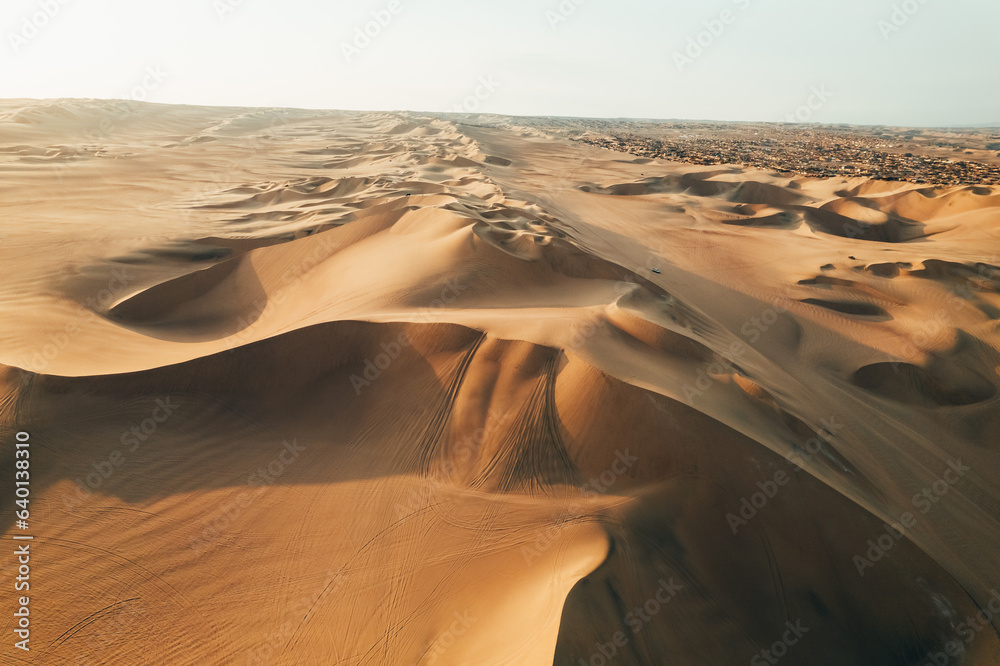 Aerial sunset photo of desert textures in Huacachina, Ica, Peru, South America