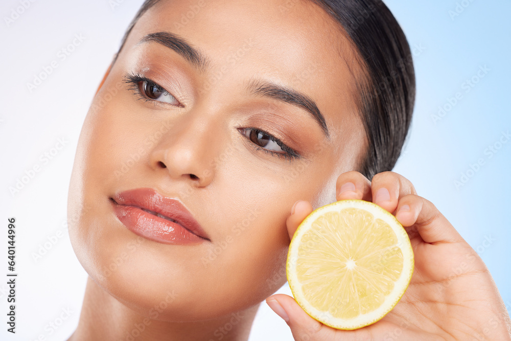 Beauty, lemon and face of studio woman with citrus fruit for organic anti aging treatment, facial de