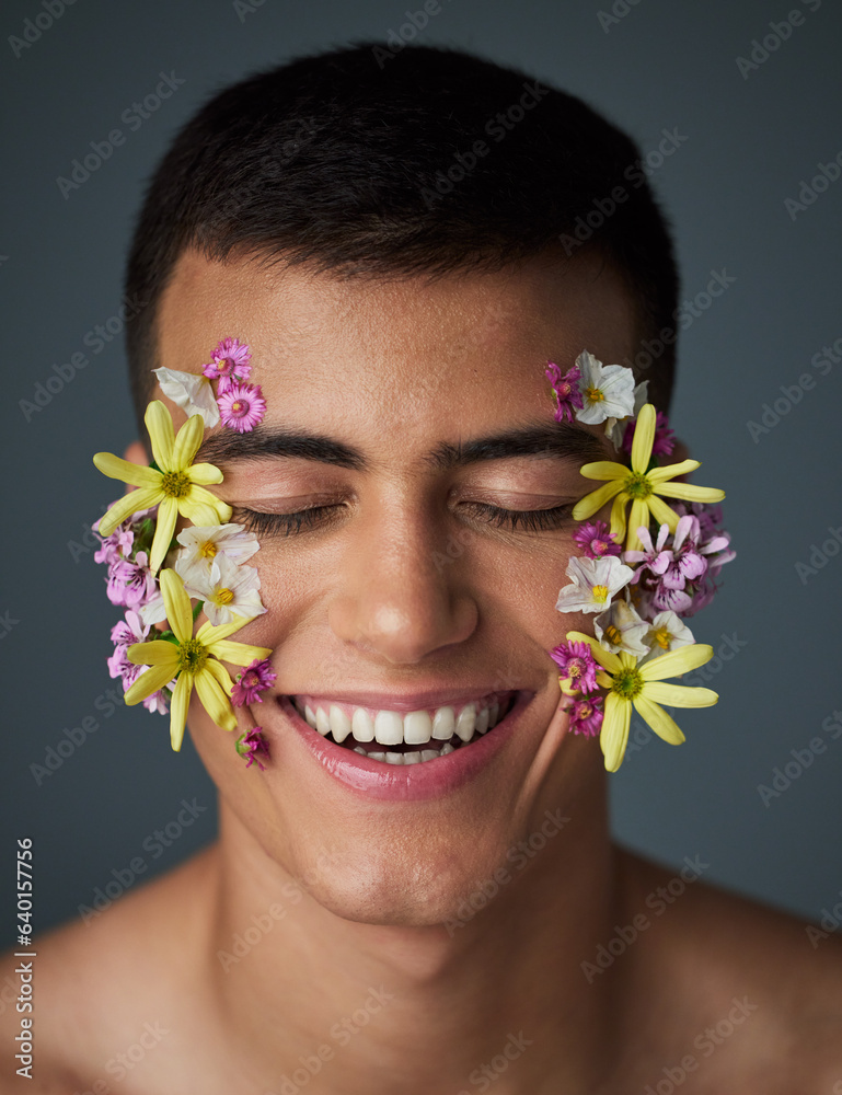 Face, happy man and flowers, beauty and natural, cosmetics and art deco isolated on studio backgroun