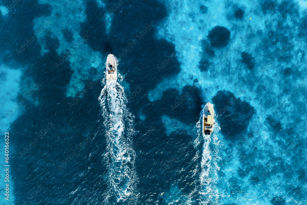 Vacation and leisure. Aerial view on fast boats on blue Mediterranean sea at sunny day. Fast ships o