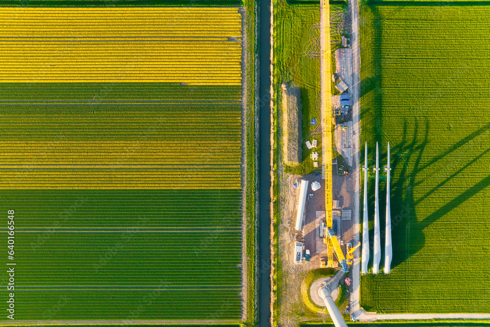 Construction and installation of a wind turbine. Production of clean green energy. Technology and in