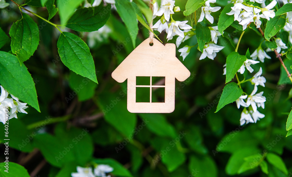 Symbol of the house on the branches of a flowering jasmine 