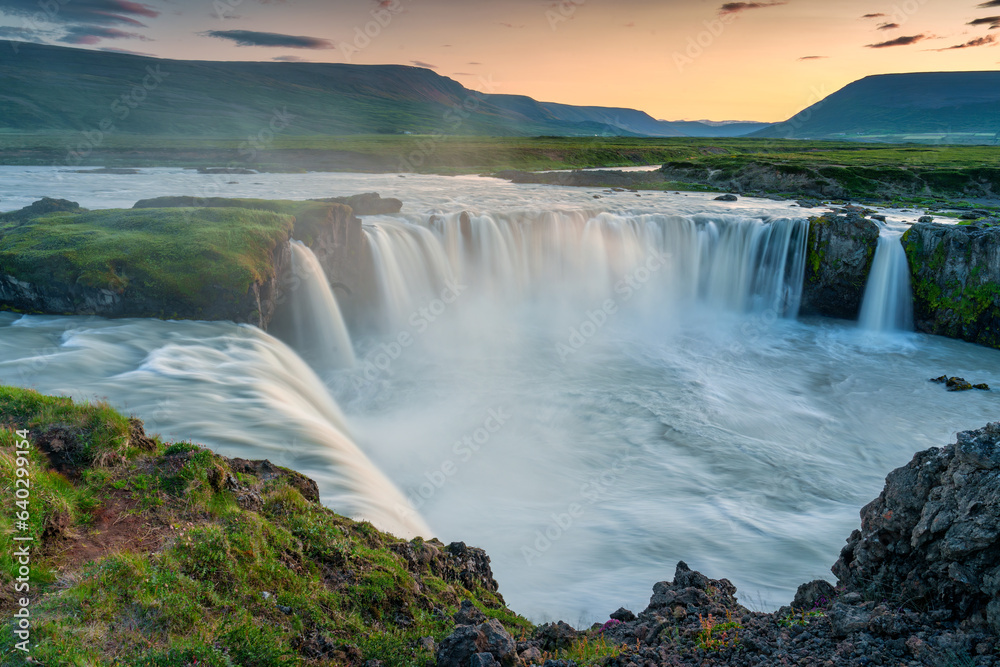 Sunset over Godafoss waterfall flowing in summer at Iceland