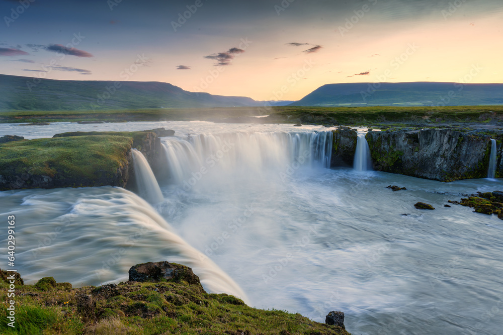 Sunset over Godafoss waterfall flowing in summer at Iceland