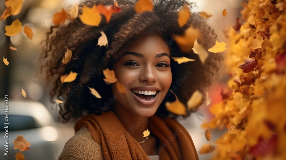 Beautiful black woman smiling in autumn leaves, Orange autumn tones.