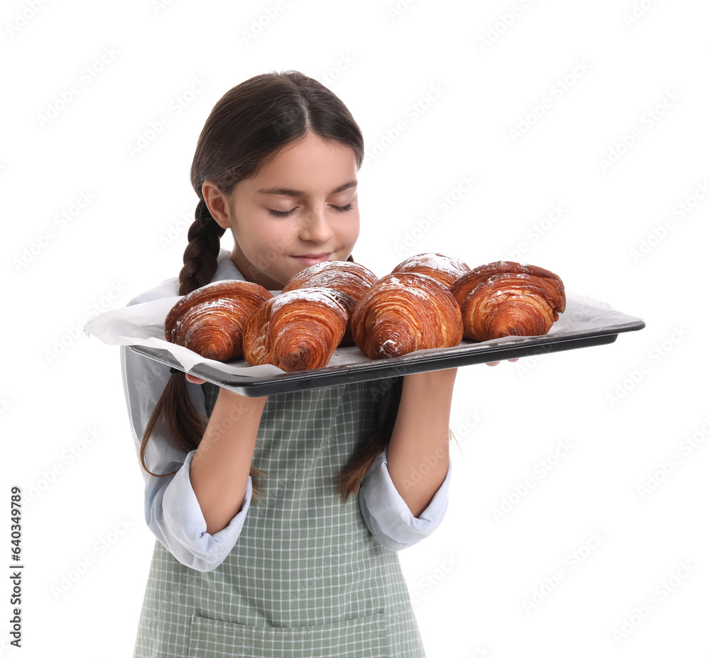 Little baker with tray of tasty croissants on white background