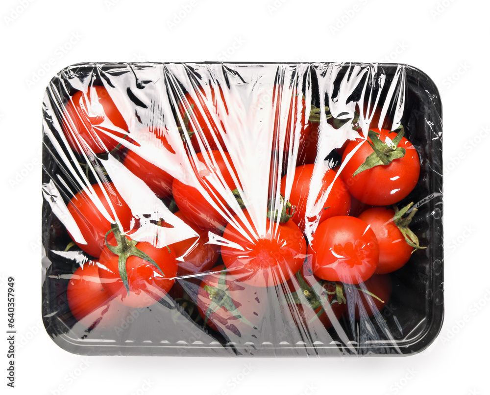 Plastic container of fresh tomatoes wrapped with stretch wrap on white background