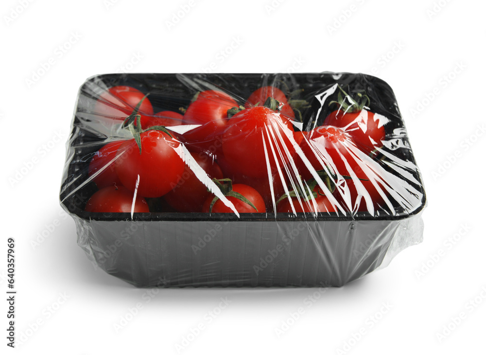 Plastic container of fresh tomatoes wrapped with stretch wrap on white background