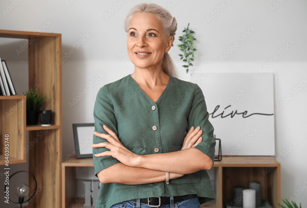 Mature woman smiling at home