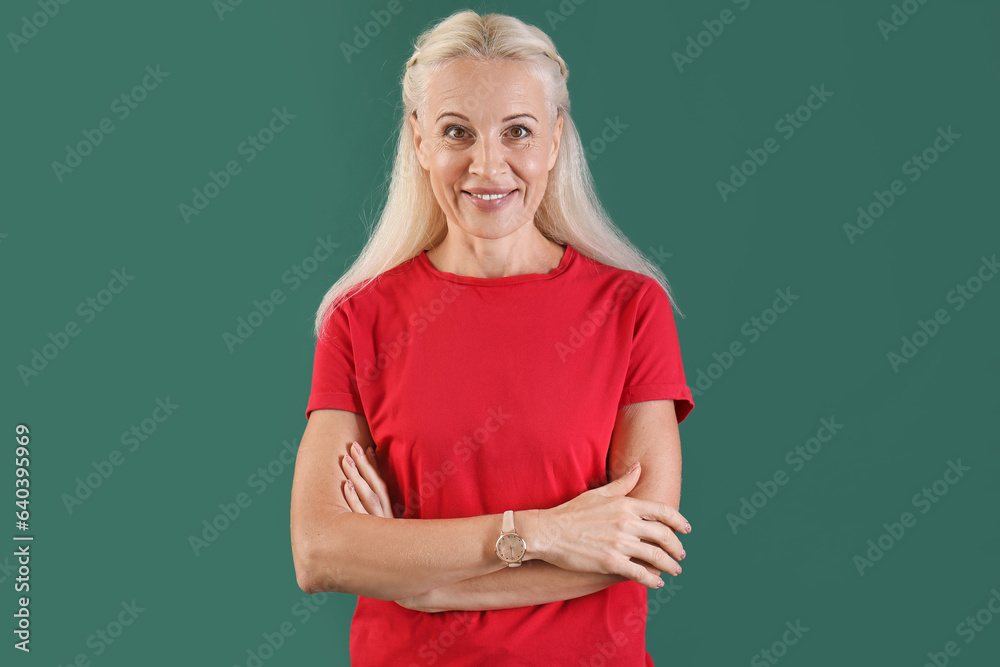 Mature woman on green background