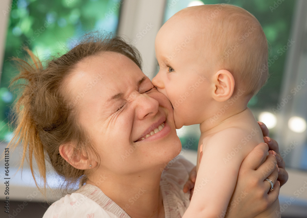 portrait of a cute baby with mom