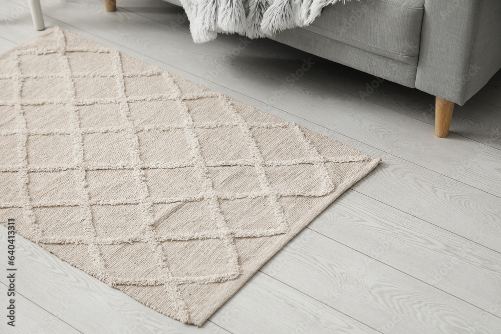 Stylish rug in living room, closeup