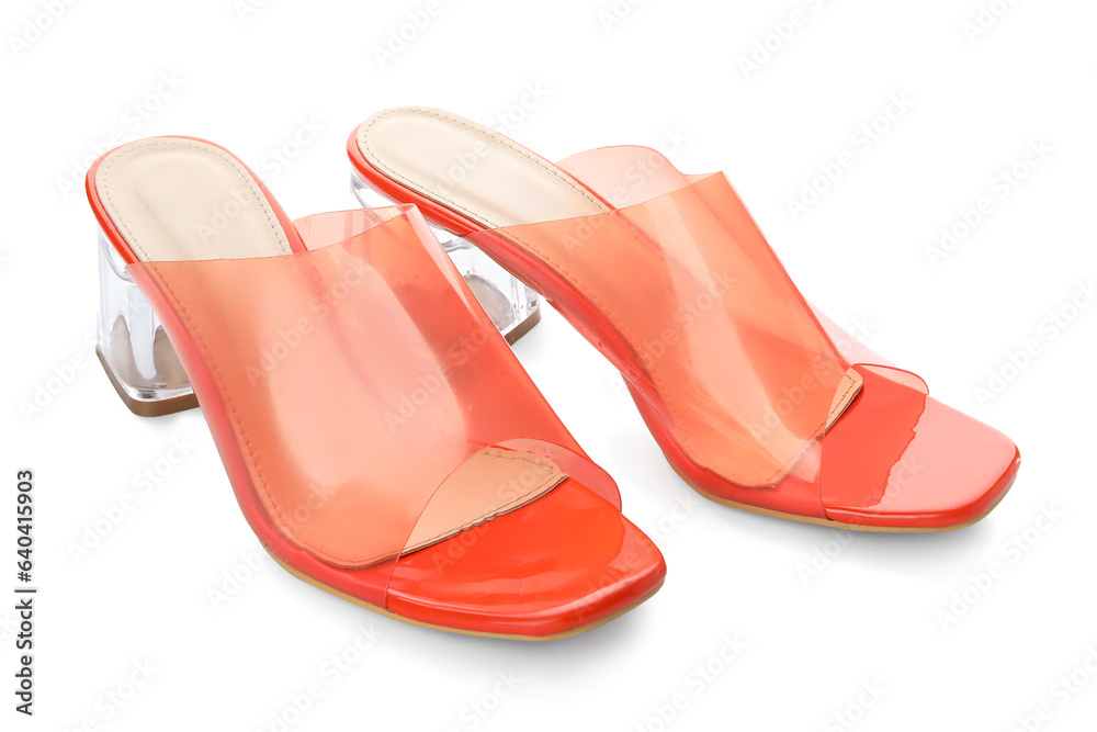 Stylish orange sandals on white background