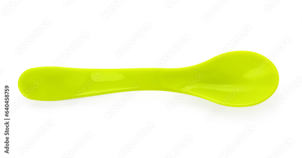 Green plastic spoon for baby on white background