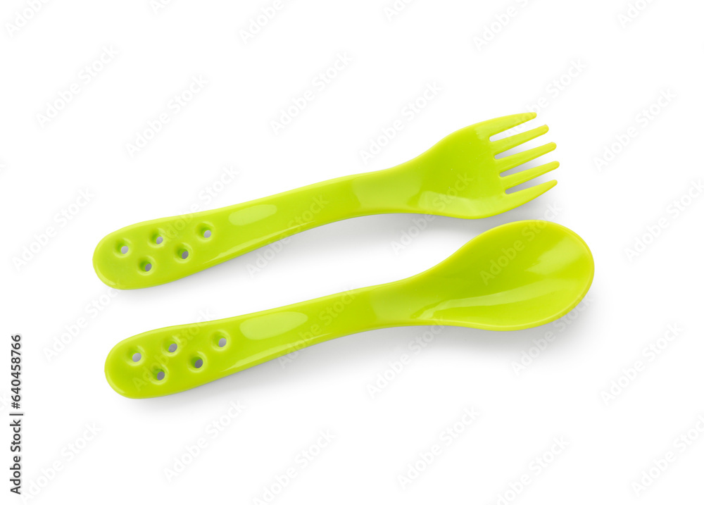 Colorful cutlery for baby on white background