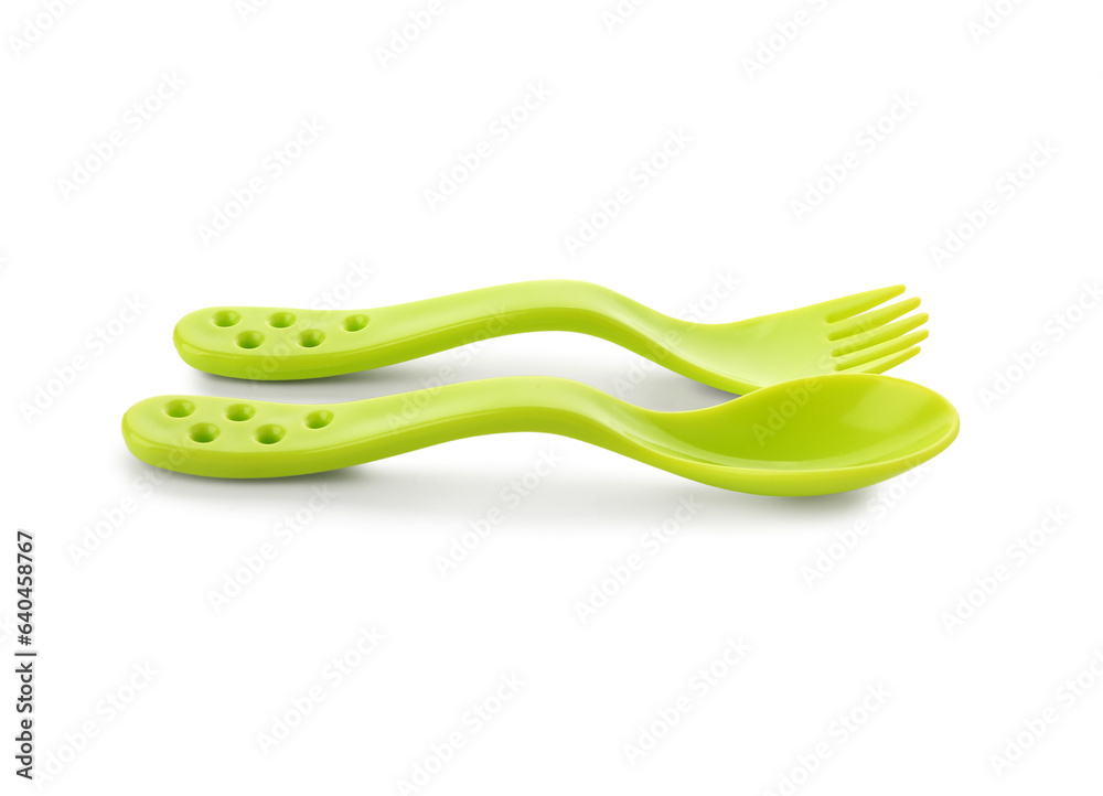 Colorful cutlery for baby on white background