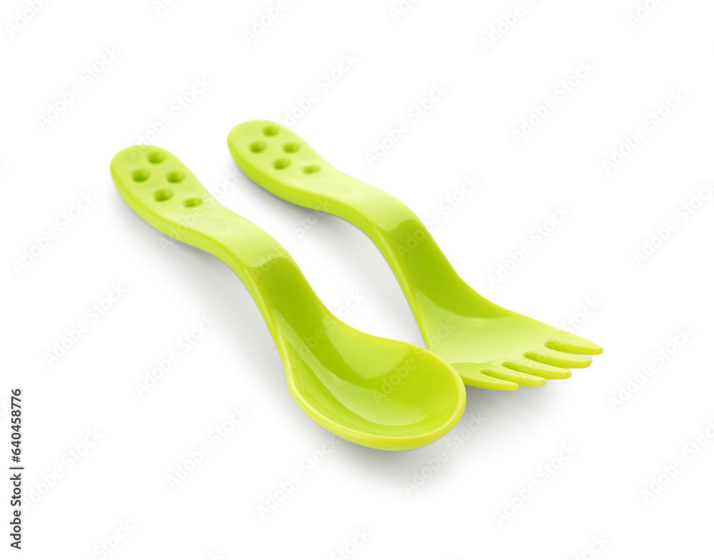 Colorful cutlery for baby on white background