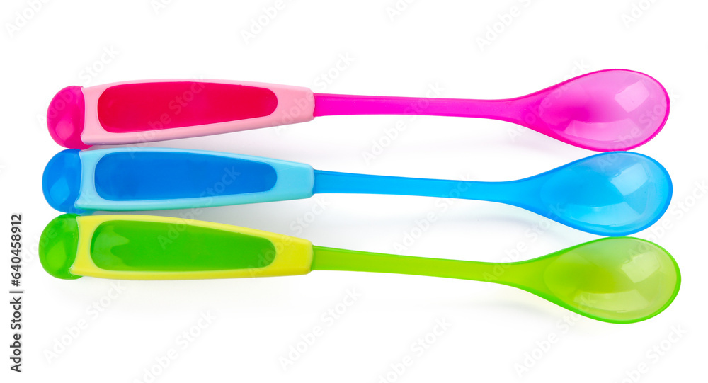 Colorful spoons for baby isolated on white background