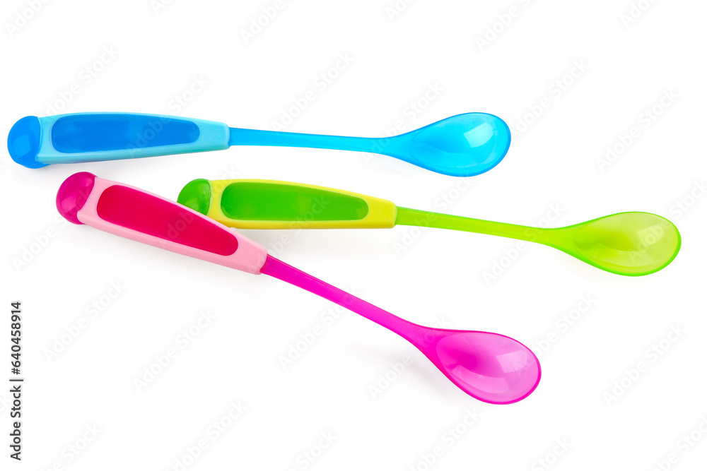 Colorful spoons for baby isolated on white background