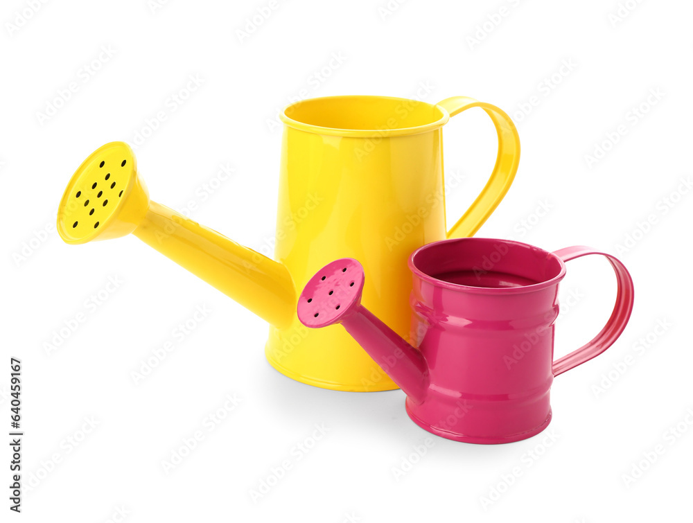 Colorful watering cans isolated on white background