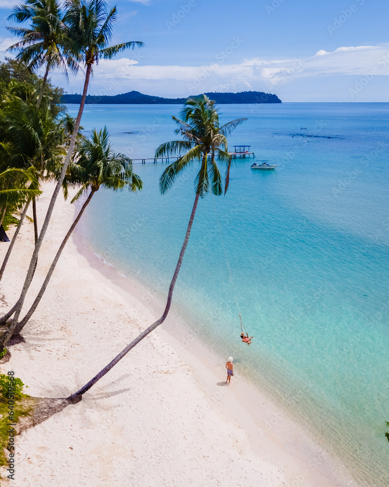 Tropical Island Koh Kood or Koh Kut Thailand. Couple men and women on vacation in Thailand playing w