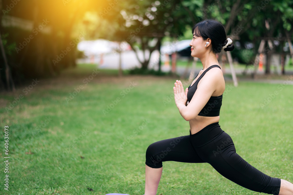 portrait fit young 30s Asian woman in pink sportswear. stretching muscles in park. Cultivate vibrant