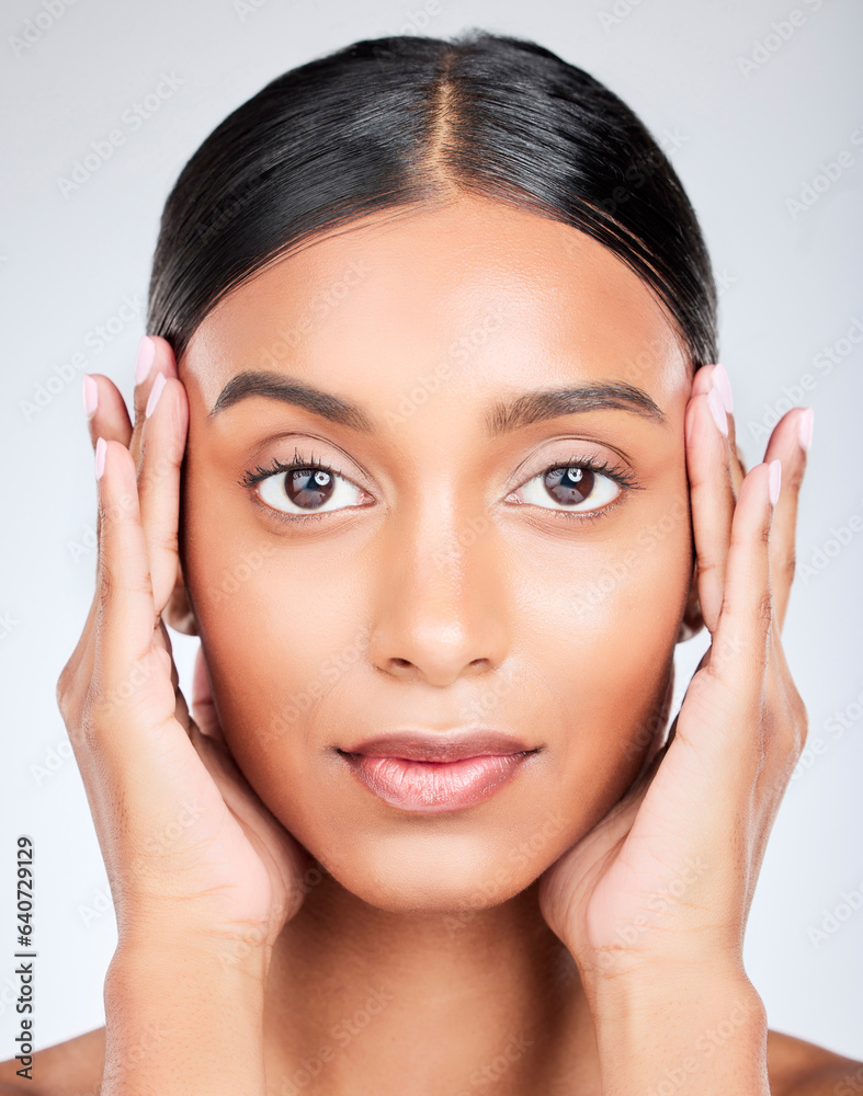 Studio portrait of Indian woman with hands for skincare, beauty and cosmetics on white background. D