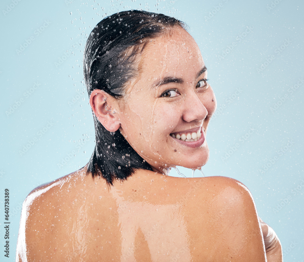 Skincare, shower back and face of woman cleaning in studio isolated on a blue background. Water spla