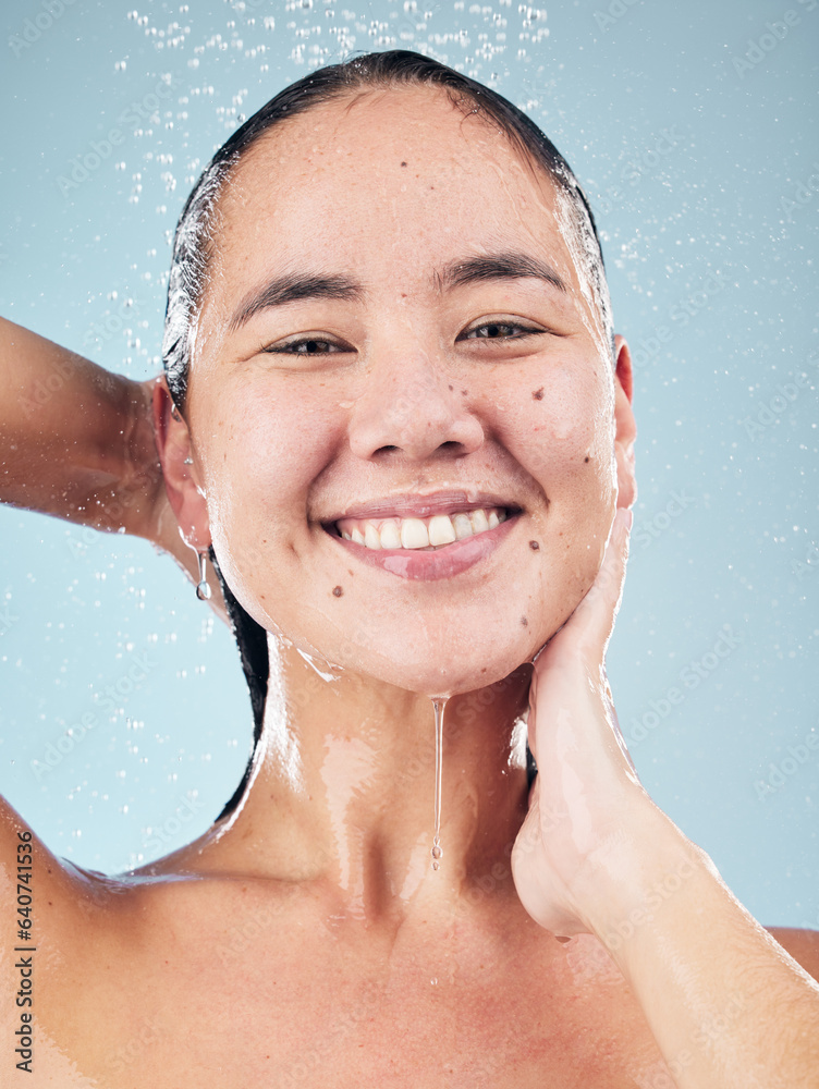 Skincare, water splash and face of woman cleaning in studio isolated on a blue background. Shower, h